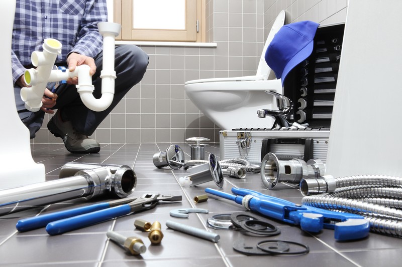 Plumber,At,Work,In,A,Bathroom,,Plumbing,Repair,Service,,Assemble